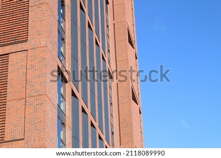 Close up of wall of student flats with sky. Wall with sky in England.