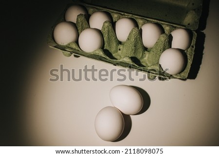 chicken eggs white in a green box