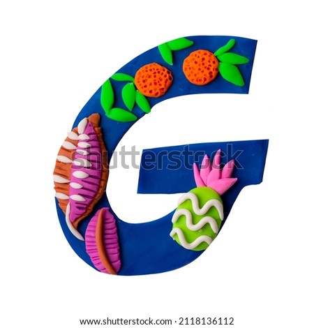 Plasticine handmade craft letters with tropical design, palm, flowers. 