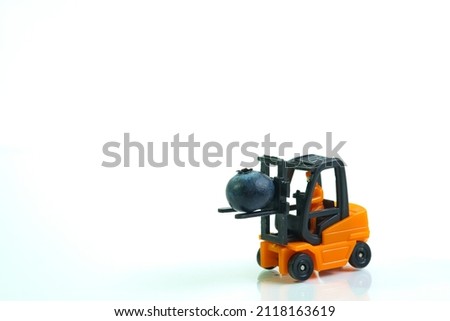 a forklift transports a blueberry, white background, copy space