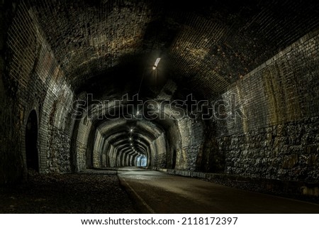 A high dynamic range image captured inside the disused Cressbrook Tunnel on the Monsal Trail.  Royalty-Free Stock Photo #2118172397