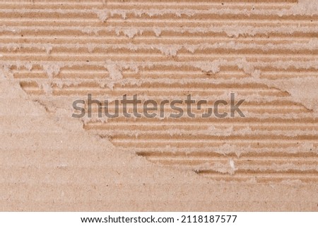 torn brown packing cardboard. background for design. High quality photo