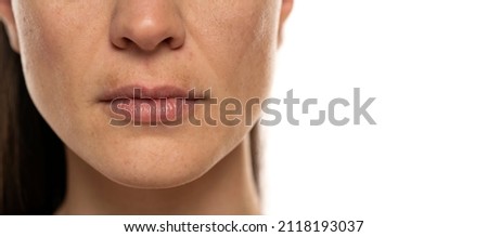 macro shot of a female face with dark skin on the upper lip Royalty-Free Stock Photo #2118193037