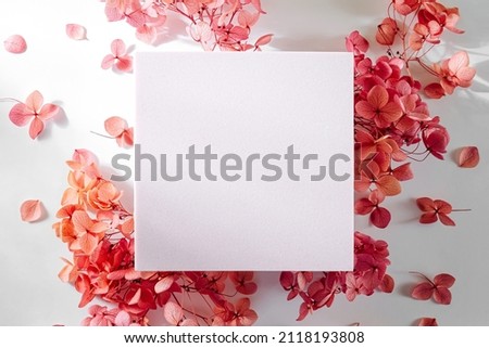 Empty card with pink flowers. Mock card up on stylish background for presentation or design. Festive and spring consept. Mothers day card or Womens day