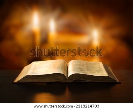 Grunge age dirty rough rustic brown psalm pray torah law letter archiv stack dark black wooden desk table space. New jew culture god Jesus Christ gospel literary art wood still life flame fire concept Royalty-Free Stock Photo #2118214703