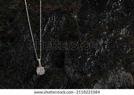 Diamond background. Diamond necklace on black stone background