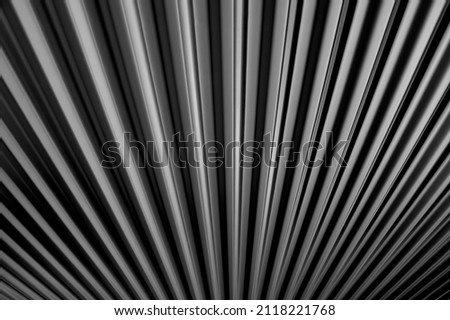 A radiator lit by two complimentary coloured light sources then converted to black and white