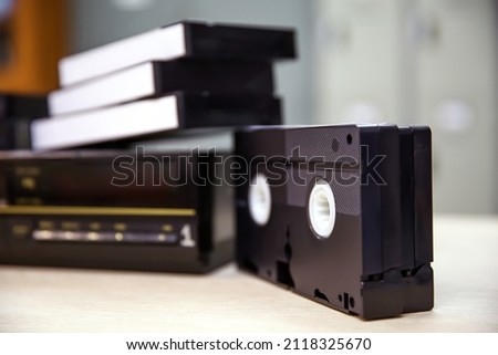 Close-up video cassette tape VHS old retro style concept of vintage electric and electronic appliances multimedia record player device old fashioned.