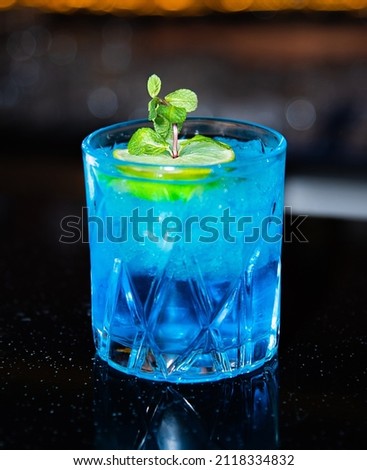Blue Lagoon Cocktail. decorated with mint. with ice.