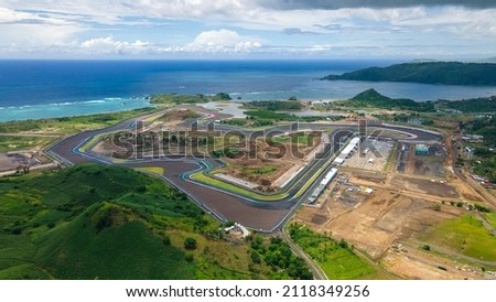 Aerial shot of Mandalika International Circuit with beautiful background of Kuta beach Lombok Royalty-Free Stock Photo #2118349256