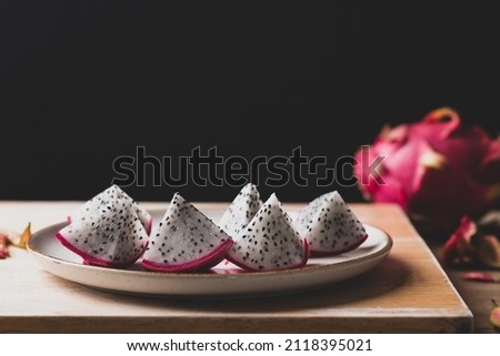 Sliced dragon fruit or pitaya ready to eating with black background, Tropical fruit