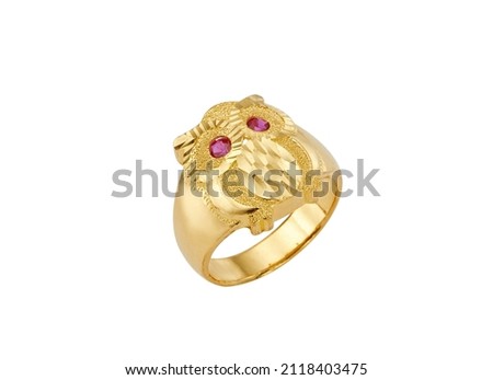 gold rings set with ruby and precious tips on a white background, picture with depth of field.owl icon fashion ring.