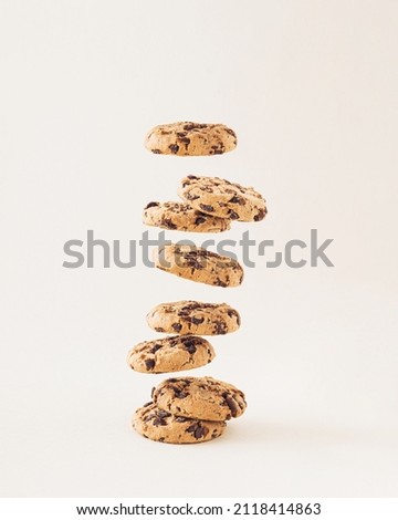 Chocolate chip cookies on the cream background. Sweet food biscuit concept. Royalty-Free Stock Photo #2118414863