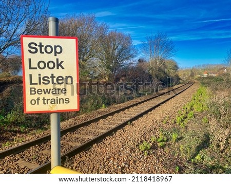 Stop, look and listen train sign