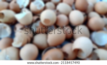 Shell of an egg with many eggshells, and bokeh blurred background.