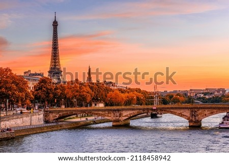 Sunset view of Eiffel tower and Seine river in Paris, France. Autumn Paris Royalty-Free Stock Photo #2118458942