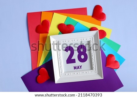 day of the month 28 May calendar    Calendar date in a white frame on a rainbow background.