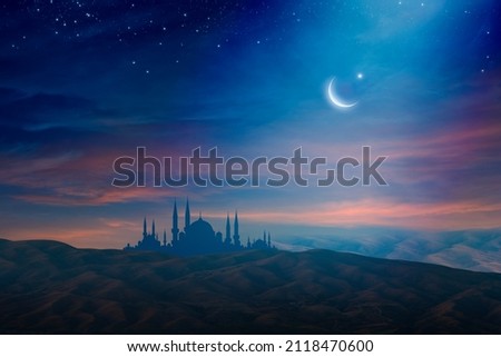 Ramadan background with crescent, stars and glowing clouds above mosque on mountains. Month of Ramadan is that in which was revealed Quran. Mixed media image. Royalty-Free Stock Photo #2118470600