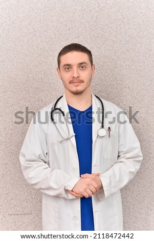 Portrait of a handsome doctor wearing a lab coat