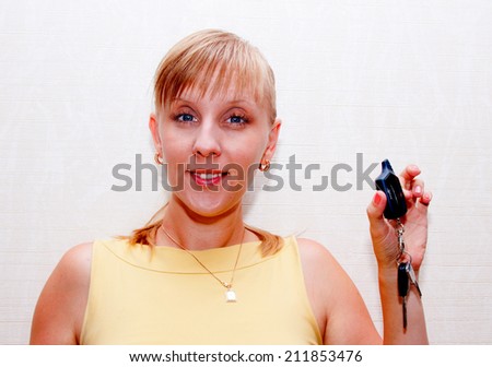 Blonde woman with car keys in hand