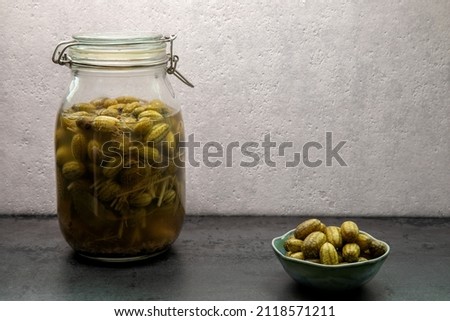Pickled cucamelon in jar. Preserved canned food from own garden.