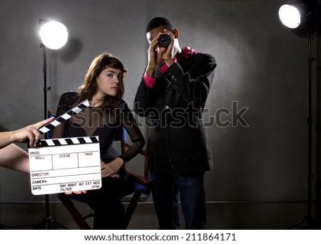Hollywood film industry producers or directors in a sound stage Royalty-Free Stock Photo #211864171