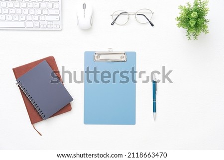 view of the desk with the business items, top view