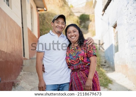 Happy Hispanic couple in the village - Guatemalan couple with typical Mayan costume Royalty-Free Stock Photo #2118679673