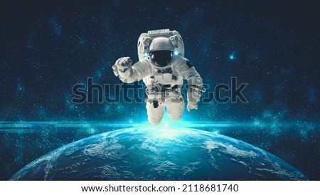 Astronaut spaceman do spacewalk while working for spaceflight mission at space station . Astronaut wear full spacesuit for operation . Elements of this image furnished by NASA space astronaut photos . Royalty-Free Stock Photo #2118681740