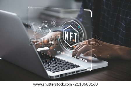 Businessman using a computer for NFT non fungible token for crypto art blockchain technology concept. Royalty-Free Stock Photo #2118688160