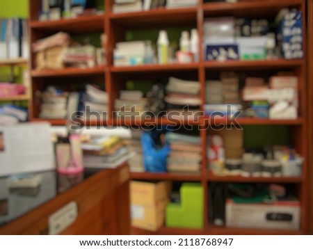 defocused abstract background of office supplies cupboard