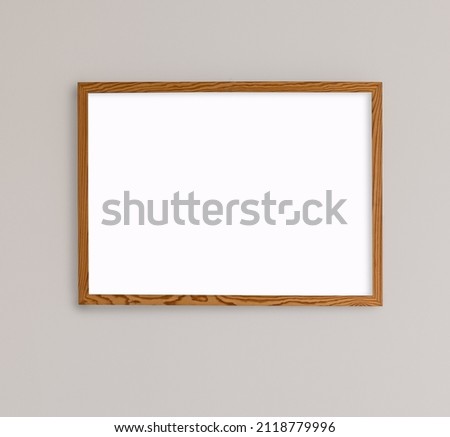 empty frame on a grey wall