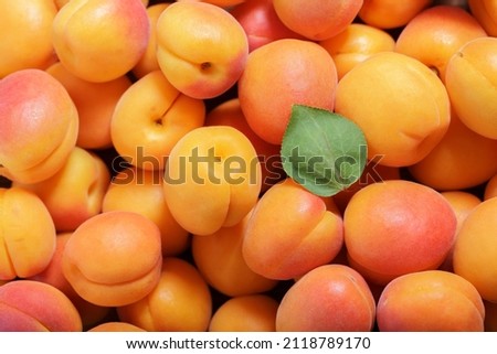 fresh ripe apricots as background, top view Royalty-Free Stock Photo #2118789170