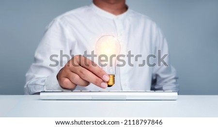 Digital global connection technology and management icons in light bulb in businessman's hand, work with computer. Innovation. Creativity idea, business solution concept, new invention by inspiration.