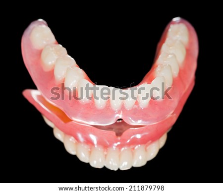 Artificial lower denture on isolated  black background