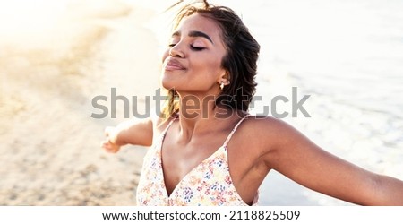 Free happy woman with open arms enjoying nature - Joyful black girl outdoors  breathing fresh air - Enjoyment, freedom, happiness and mental health concept Royalty-Free Stock Photo #2118825509