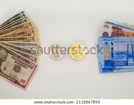 coins bitcoin, dollars and russian rubles on a white background