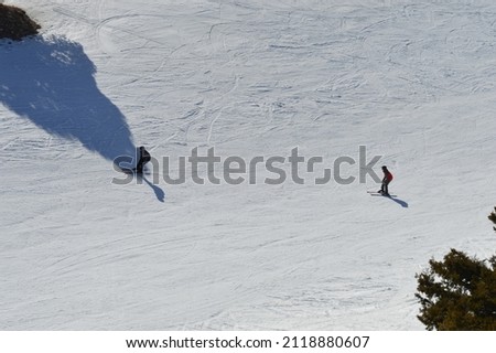 winter tourism person skiing and snowboarding