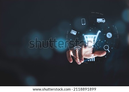 Hand touching to virtual info graphics with trolley cart icons , Technology online shopping business concept. Royalty-Free Stock Photo #2118891899