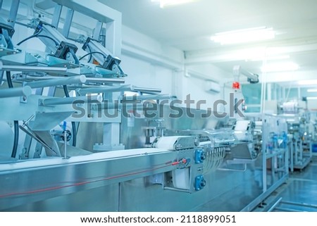 factory, industrial area, automation, technology, Machines for packing products Within the factory, sterile beauty industry in order to maintain maximum cleanliness.shallow focus effect. soft focus.
 Royalty-Free Stock Photo #2118899051