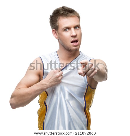 aggressive young basketball player pointing at camera isolated on white
