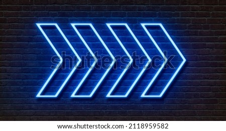 Neon sign on a brick wall - Arrows Royalty-Free Stock Photo #2118959582