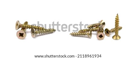 Scattered wood screws isolated on white background