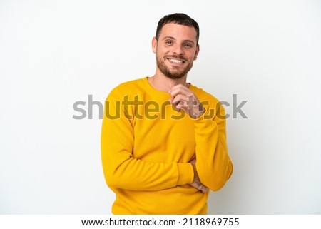 Young Brazilian man isolated on white background laughing