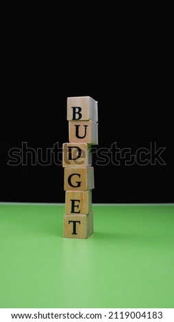 Budget written with wooden letter blocks.