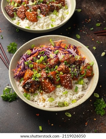 Vegan fried tempeh with rice and vegetables. Asian healthy food Royalty-Free Stock Photo #2119026050