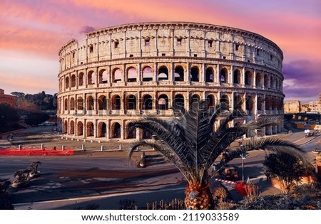 Colosseum (Coliseum or Colosseo) in Rome, Italy. Ancient ruins of Flavian Amphitheatre. Arena for gladiator fightings. World famous landmark and very popular touristic destination for vacation trip. Royalty-Free Stock Photo #2119033589