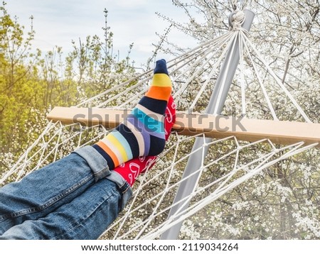 Men's legs and bright socks. Close-up, outdoor. Style, beauty and elegance concept