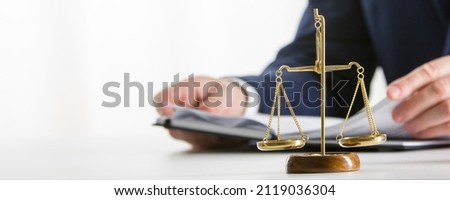 Lawyer working with contract papers and wooden gavel on tabel in courtroom. justice and law ,attorney, court judge concept