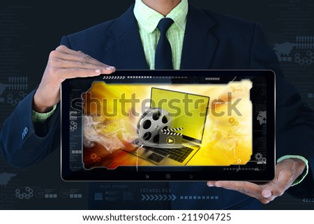 man showing Laptop with reel in frame